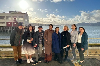 Schirch (third from right) with Kroc Institute students in San Francisco in a group photo by the water