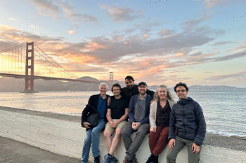 Schirch with computer scientists posing in front of the Golden Gate Bridge in San Francisco