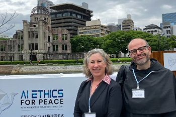 Schirch with Father Paolo Benanti in the Peace Park in Hiroshima, Japan