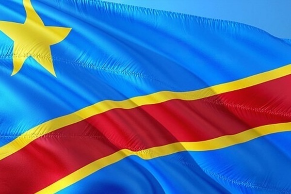 Flag of the Democratic Republic of Congo, featuring a light blue field with a diagonal red stripe bordered by yellow, and a large yellow star in the upper left corner.