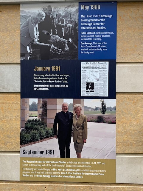 A poster of Joan B. Kroc and Father Theodore Hesburgh, C.S.C., hangs in the Hesburgh Center in celebration of the Kroc Institute's 40th anniversary.