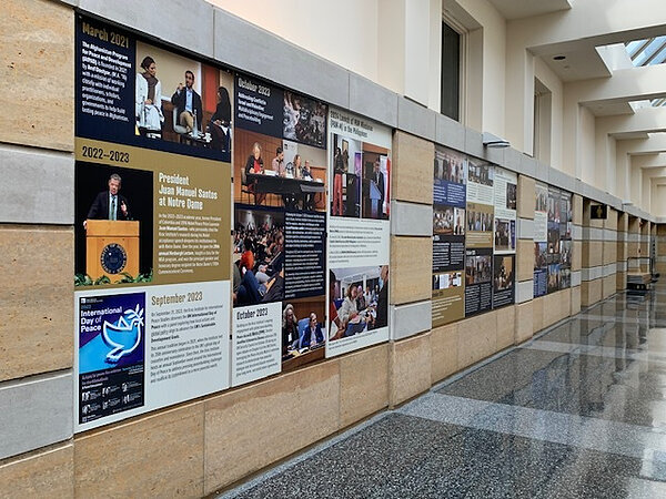 Colorful posters hang along the walls of the Hesburgh Center in celebration of the Kroc Institute's 40th Anniversary.